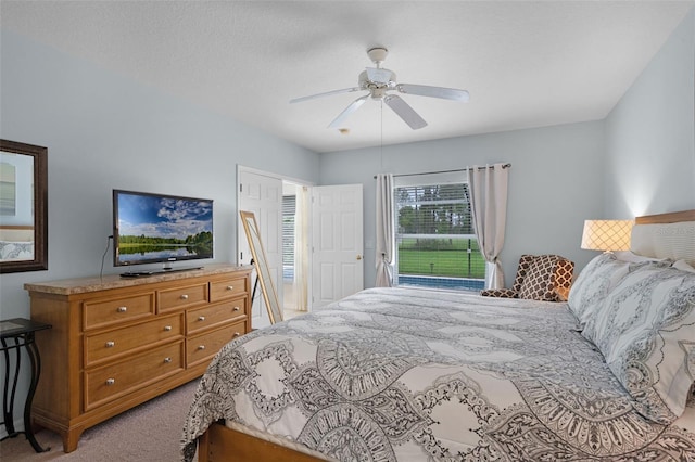 909 Troon Cir, Davenport, FL 33897 - bedroom with light colored carpet and ceiling fan