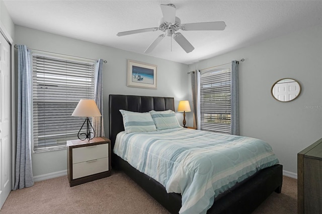 909 Troon Cir, Davenport, FL 33897 - carpeted bedroom featuring baseboards and ceiling fan