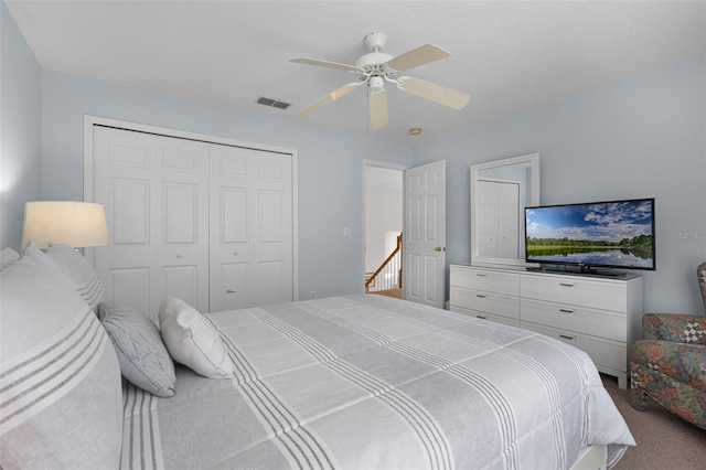 909 Troon Cir, Davenport, FL 33897 - bedroom featuring a closet, carpet floors, and ceiling fan