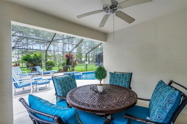 909 Troon Cir, Davenport, FL 33897 - view of patio featuring ceiling fan, an outdoor pool, outdoor dining area, and glass enclosure
