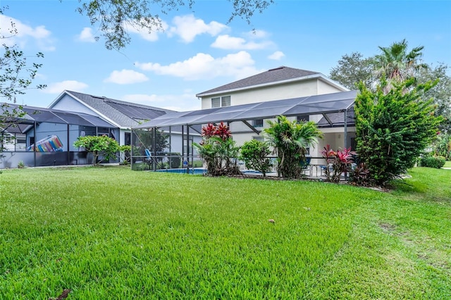909 Troon Cir, Davenport, FL 33897 - rear view of house with a yard and stucco siding
