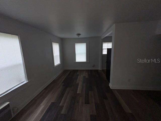 3029 Azalea Ave, Lake Wales, FL 33898 - unfurnished room featuring dark wood-style floors and baseboards