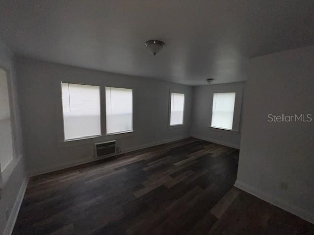 3029 Azalea Ave, Lake Wales, FL 33898 - spare room with wood finished floors and a wall unit AC