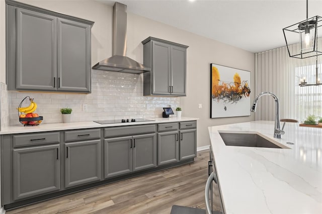5133 Citrus Leaf Blvd, Winter Garden, FL 34787 - kitchen featuring wall chimney range hood, gray cabinetry, and black electric cooktop
