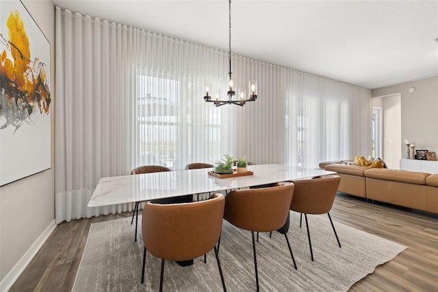 5133 Citrus Leaf Blvd, Winter Garden, FL 34787 - dining area featuring wood finished floors and a chandelier