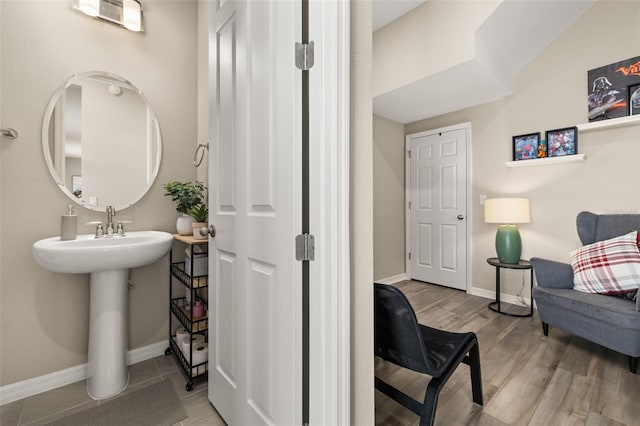 5133 Citrus Leaf Blvd, Winter Garden, FL 34787 - bathroom featuring baseboards and wood finished floors