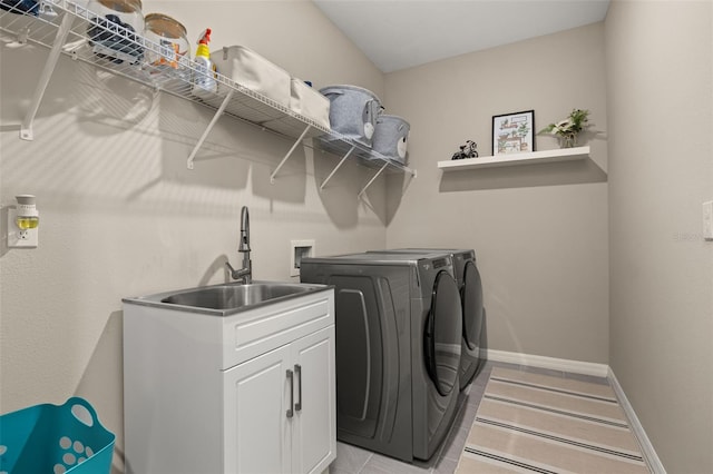 5133 Citrus Leaf Blvd, Winter Garden, FL 34787 - laundry area with washer and dryer and light tile patterned floors