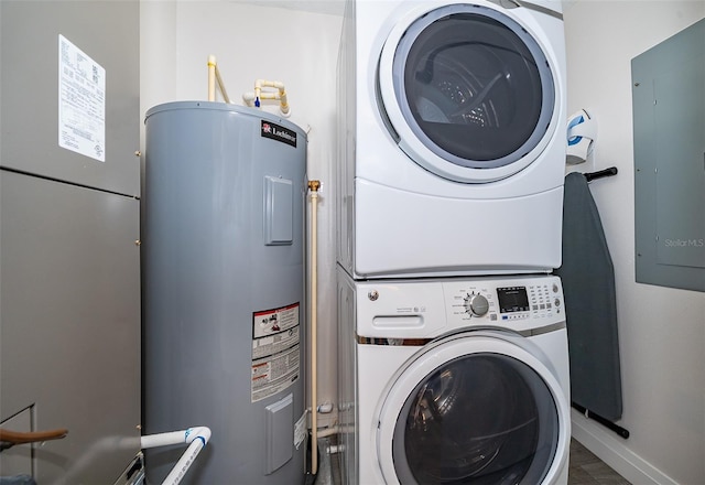 14501 Grove Resort Ave Unit 2534, Winter Garden, FL 34787 - laundry room featuring water heater, stacked washer / dryer, and electric panel