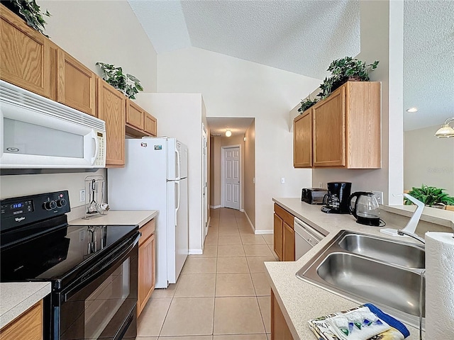 2649 Hemingway Ave, Haines City, FL 33844 - kitchen with white appliances, a textured ceiling, light tile patterned floors, light countertops, and high vaulted ceiling