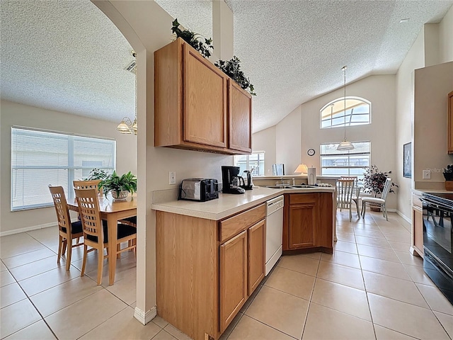 2649 Hemingway Ave, Haines City, FL 33844 - kitchen featuring a textured ceiling, vaulted ceiling, white dishwasher, light tile patterned floors, and light countertops