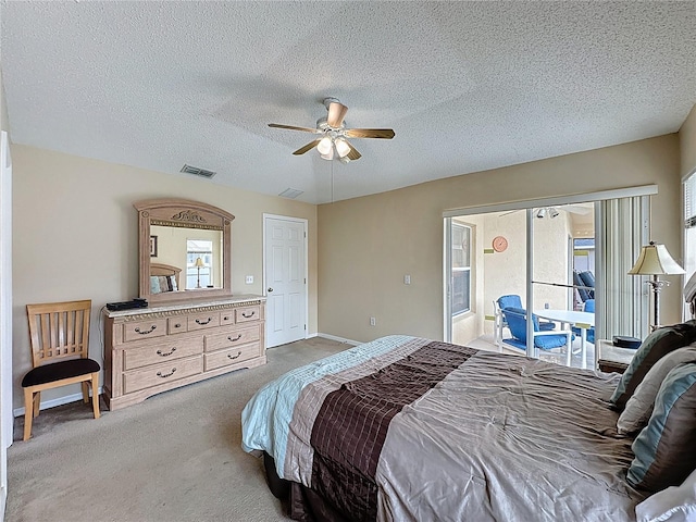 2649 Hemingway Ave, Haines City, FL 33844 - bedroom featuring carpet floors, a ceiling fan, a textured ceiling, and access to exterior
