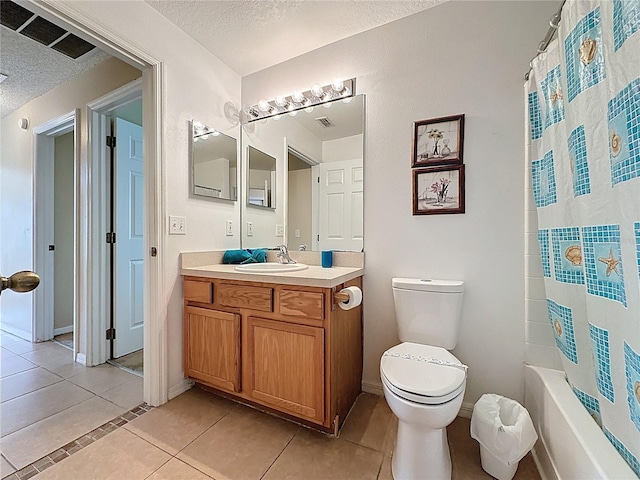 2649 Hemingway Ave, Haines City, FL 33844 - bathroom featuring a textured ceiling, tile patterned flooring, vanity, and shower / bath combo