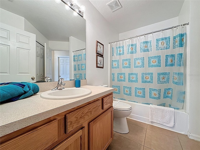 2649 Hemingway Ave, Haines City, FL 33844 - full bathroom with vanity, tile patterned floors, and shower / bath combo