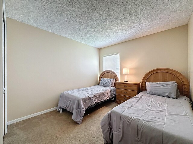 2649 Hemingway Ave, Haines City, FL 33844 - bedroom with carpet floors and a textured ceiling