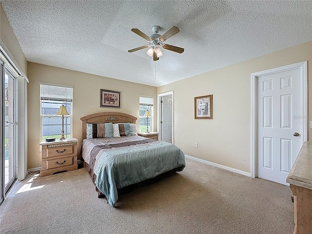 2649 Hemingway Ave, Haines City, FL 33844 - bedroom with light carpet, a textured ceiling, and ceiling fan