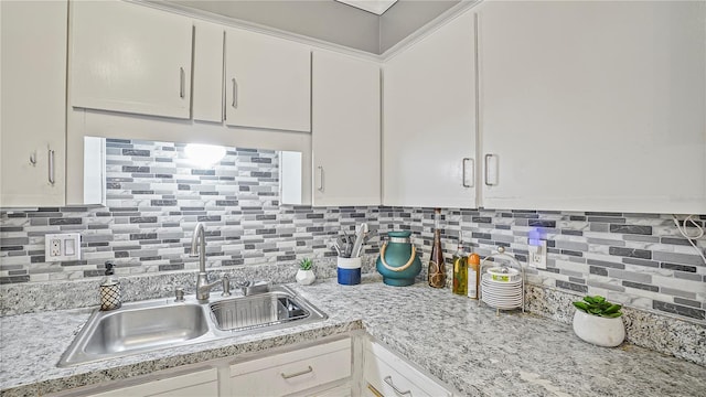 505 Oak Dr, Tavares, FL 32778 - kitchen with white cabinets and decorative backsplash