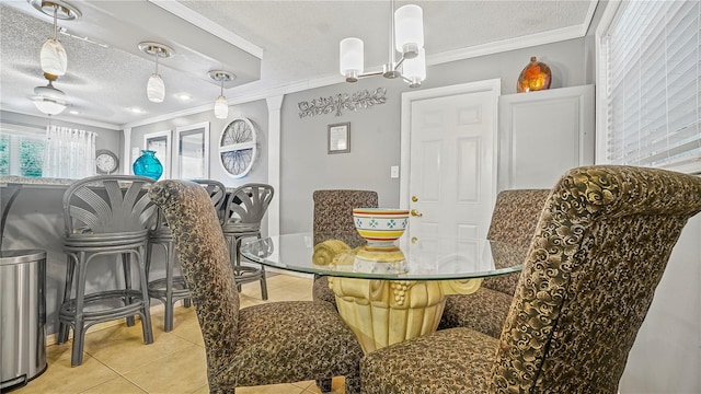505 Oak Dr, Tavares, FL 32778 - dining area with a textured ceiling, light tile patterned floors, and ornamental molding