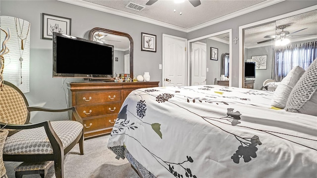 505 Oak Dr, Tavares, FL 32778 - carpeted bedroom with a textured ceiling, ceiling fan, crown molding, and multiple closets