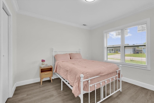1501 Missouri Ave, Saint Cloud, FL 34769 - bedroom featuring crown molding and wood finished floors