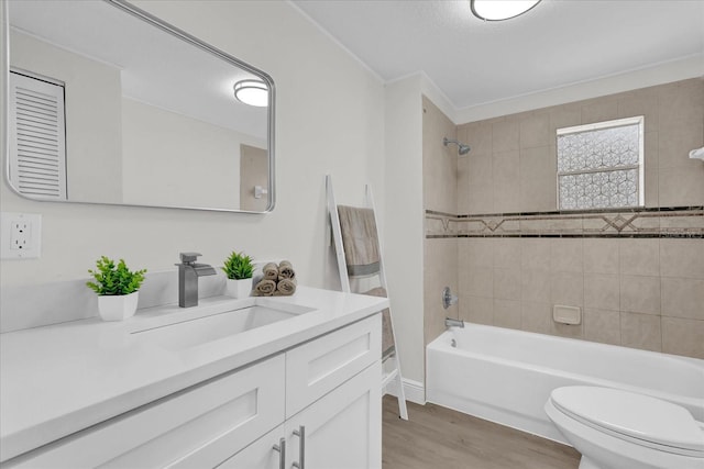 1501 Missouri Ave, Saint Cloud, FL 34769 - full bath with vanity, wood finished floors, and washtub / shower combination