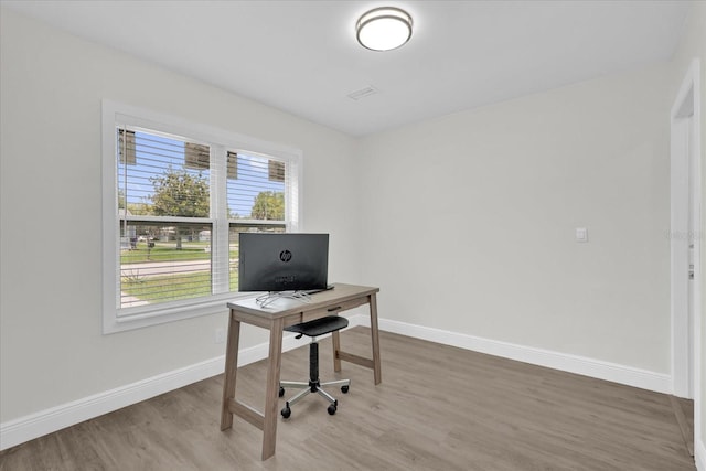 1501 Missouri Ave, Saint Cloud, FL 34769 - office area featuring wood finished floors and baseboards