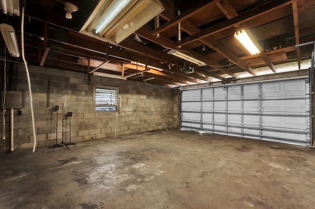 1501 Missouri Ave, Saint Cloud, FL 34769 - garage with concrete block wall and a garage door opener