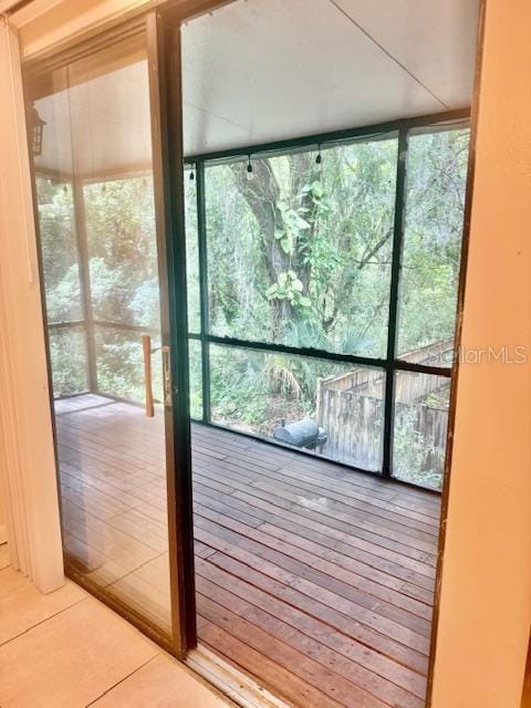 1720 Foxhall Cir Unit 1720, Kissimmee, FL 34741 - doorway to outside with plenty of natural light and a wall of windows