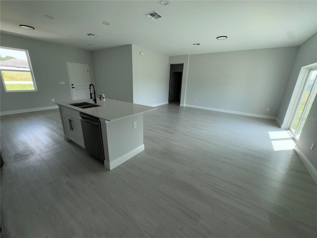 21 Pine Course Trak, Ocala, FL 34472 - kitchen with dishwasher, light wood-style flooring, a kitchen island with sink, and plenty of natural light