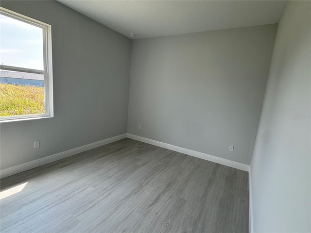 21 Pine Course Trak, Ocala, FL 34472 - unfurnished room with baseboards and wood finished floors