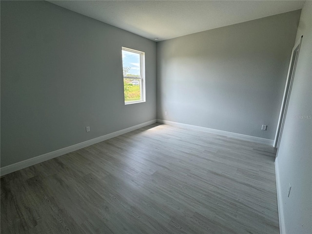 21 Pine Course Trak, Ocala, FL 34472 - empty room featuring wood finished floors and baseboards