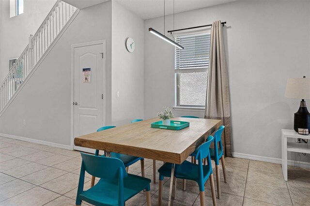8897 Rhodes St, Kissimmee, FL 34747 - dining room featuring stairs and light tile patterned flooring