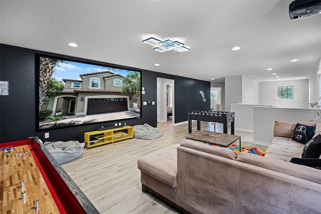 8897 Rhodes St, Kissimmee, FL 34747 - living room featuring wood finished floors, a textured ceiling, and recessed lighting