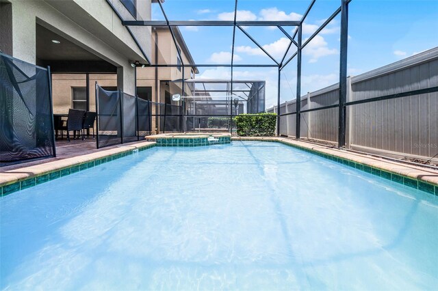 8897 Rhodes St, Kissimmee, FL 34747 - view of pool with a lanai, a pool with connected hot tub, and a patio area