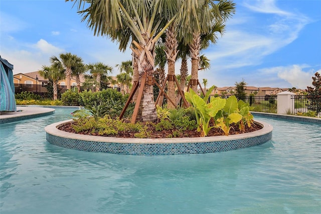 8897 Rhodes St, Kissimmee, FL 34747 - community pool featuring a residential view