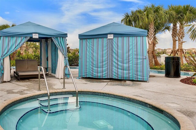 8897 Rhodes St, Kissimmee, FL 34747 - view of pool featuring an in-ground hot tub, a gazebo, a patio, and a swimming pool