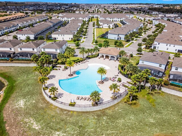 8897 Rhodes St, Kissimmee, FL 34747 - aerial perspective of suburban area featuring a pool