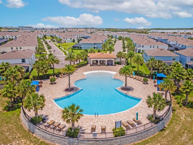 8897 Rhodes St, Kissimmee, FL 34747 - community pool with a residential view
