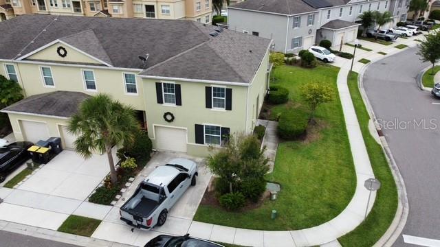 403 Arbor Lakes Dr, Davenport, FL 33896 - aerial perspective of suburban area