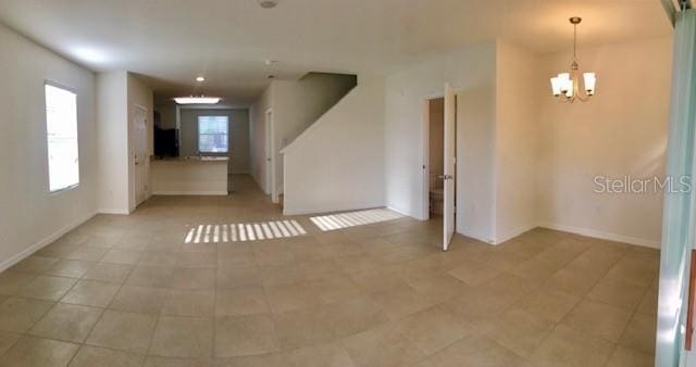 403 Arbor Lakes Dr, Davenport, FL 33896 - empty room featuring a chandelier and baseboards