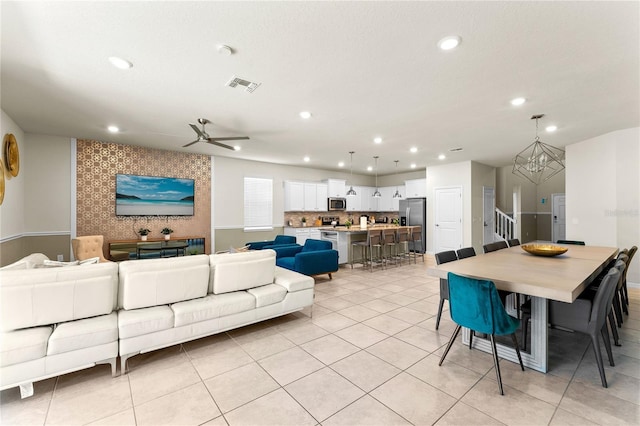 2161 Lelani Cir, Davenport, FL 33897 - living area featuring recessed lighting, a ceiling fan, a chandelier, and light tile patterned flooring