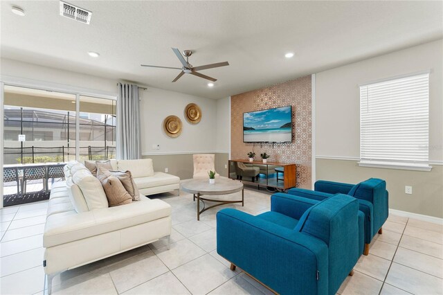 2161 Lelani Cir, Davenport, FL 33897 - living room featuring a ceiling fan, light tile patterned floors, recessed lighting, and an accent wall