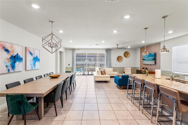 2161 Lelani Cir, Davenport, FL 33897 - dining area with recessed lighting, light tile patterned floors, a ceiling fan, and a chandelier