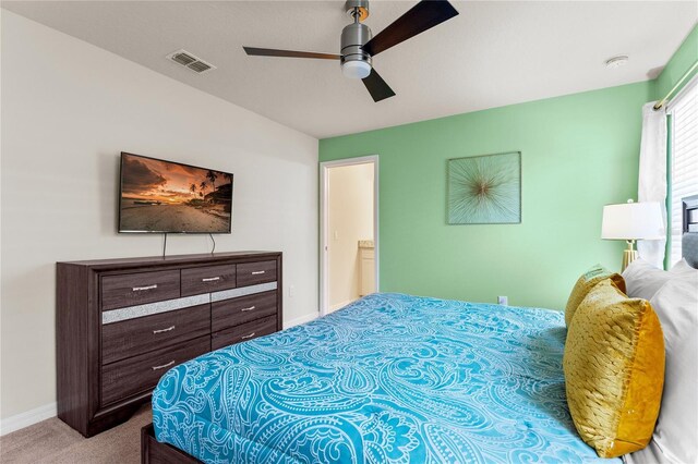 2161 Lelani Cir, Davenport, FL 33897 - carpeted bedroom with baseboards and ceiling fan
