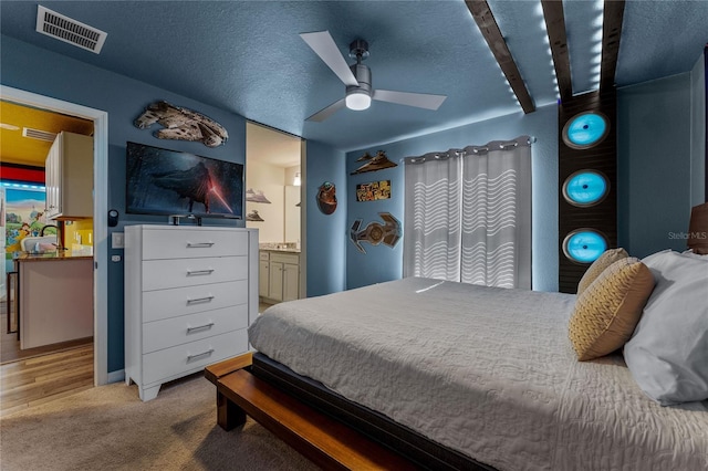 2161 Lelani Cir, Davenport, FL 33897 - carpeted bedroom with ensuite bathroom and ceiling fan