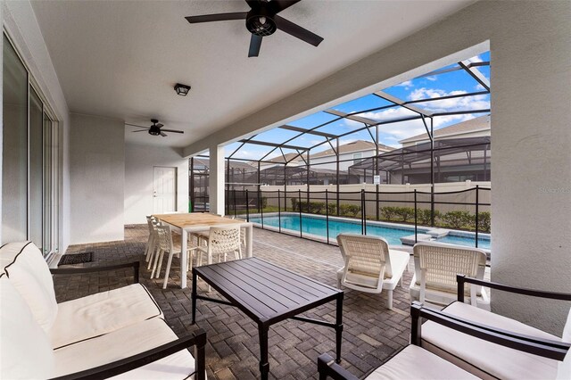 2161 Lelani Cir, Davenport, FL 33897 - view of patio / terrace with ceiling fan, an outdoor living space, and a lanai