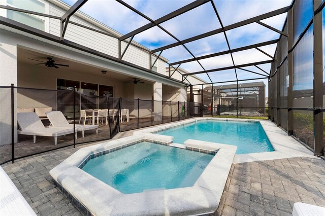2161 Lelani Cir, Davenport, FL 33897 - view of pool with a ceiling fan, a pool with connected hot tub, a patio, and a lanai