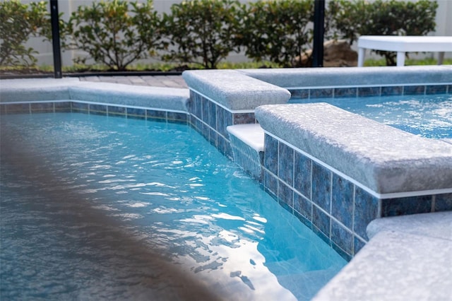 2161 Lelani Cir, Davenport, FL 33897 - view of swimming pool featuring a pool with connected hot tub