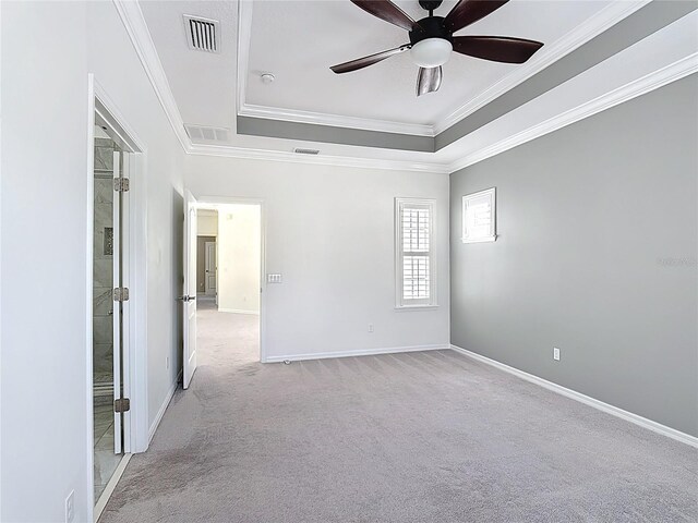 1513 Resolute St, Celebration, FL 34747 - carpeted spare room featuring a raised ceiling, ornamental molding, ceiling fan, and a smoke detector