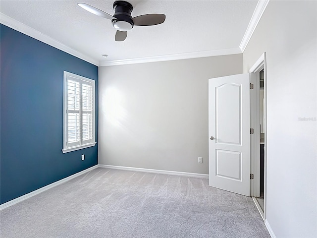 1513 Resolute St, Celebration, FL 34747 - spare room featuring crown molding, light colored carpet, and a ceiling fan