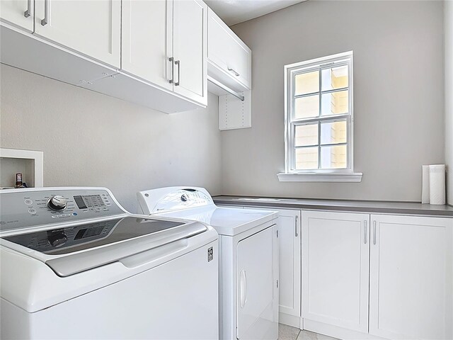 1513 Resolute St, Celebration, FL 34747 - washroom with cabinet space and washing machine and clothes dryer